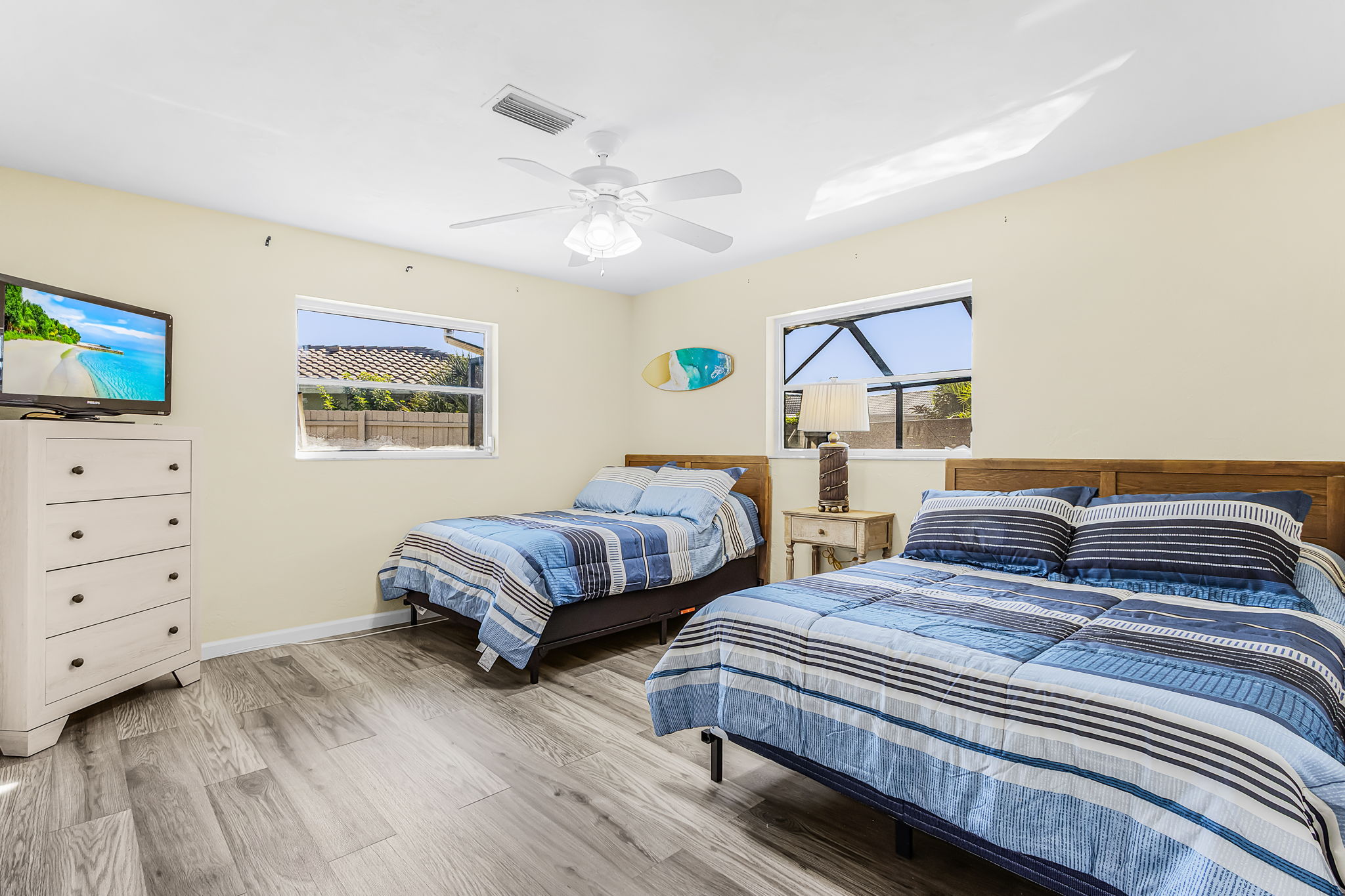 Guest bedroom with two beds — actual property photograph