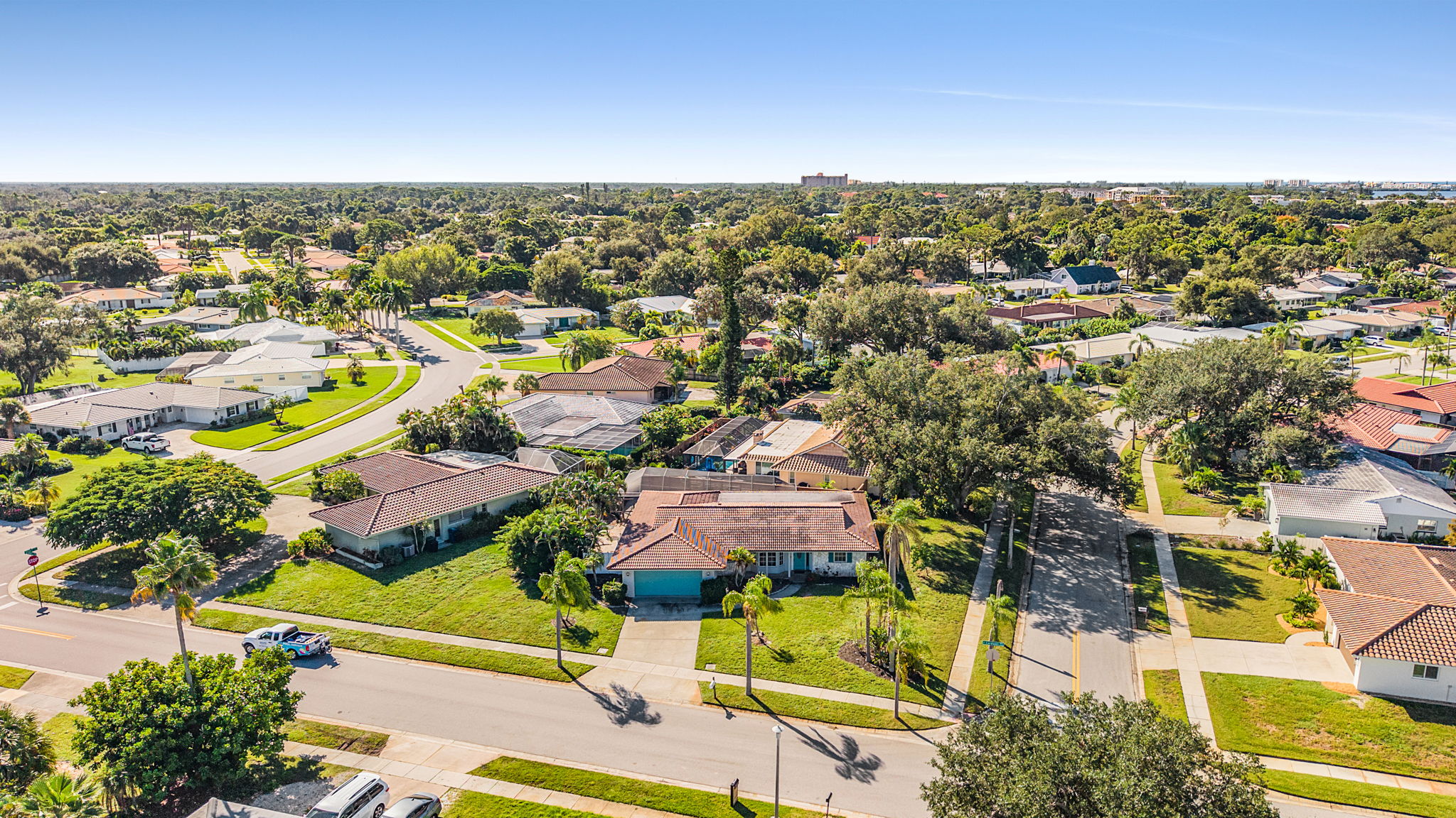 Aerial view of the home and surrounding neighborhood